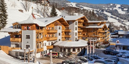 Familienhotel - Garten - Kirchdorf in Tirol - Außenansicht WInter Hotel Sonne - ALL INCLUSIVE Hotel DIE SONNE