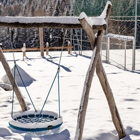 Kinderhotel: Kinderspielplatz Winter - Alpin Hotel Masl