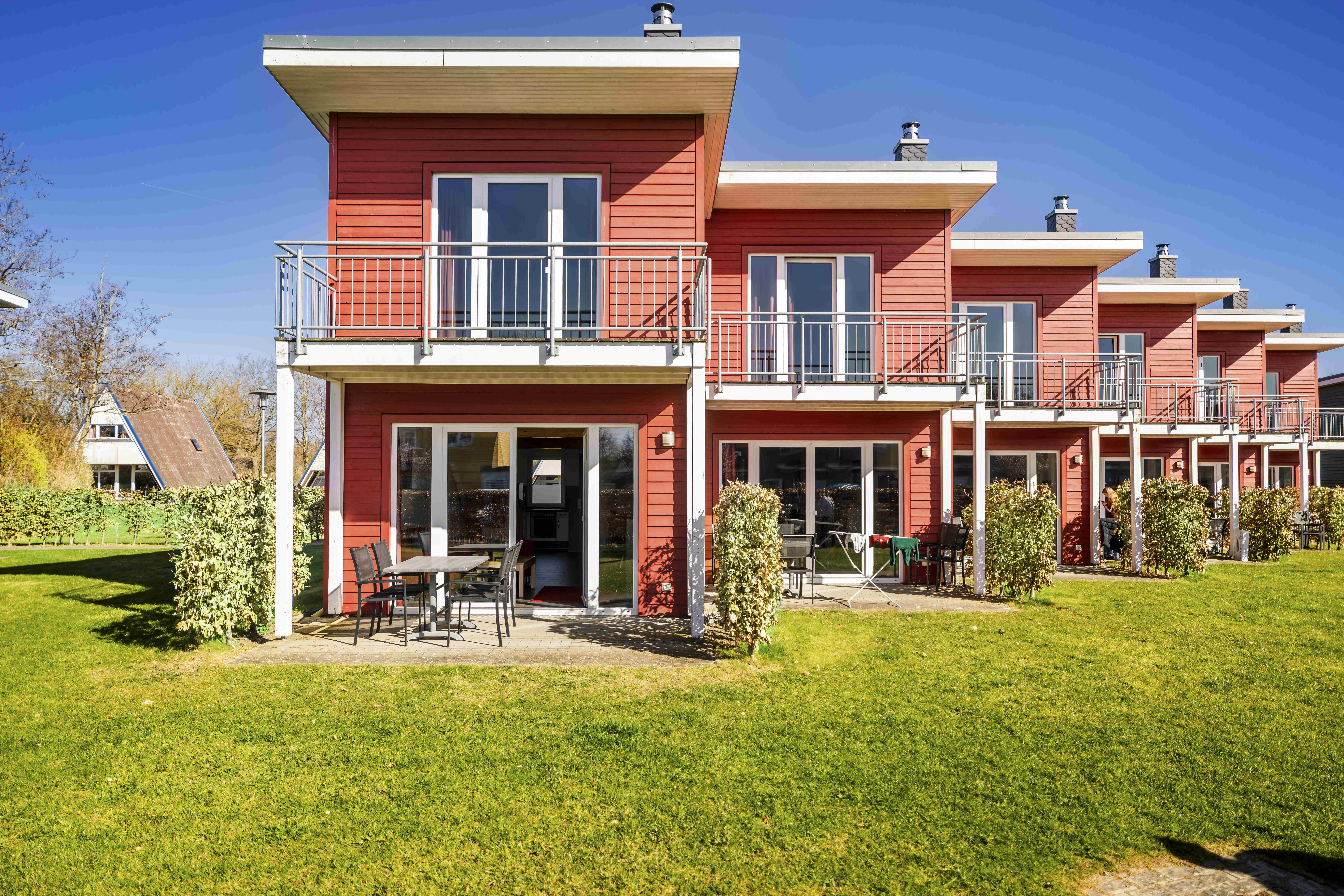 Kinderhotel: Premiumhaus Außen Ansicht - Damp Ostsee Resort & Ferienpark - Hotel | Umgebung, Wohnen | Schlafen