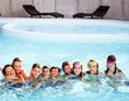 Kinderhotel: Fabilia Family Hotel Polsa - Trentino Südtirol überdachter Pool - Fabilia Family Hotel Polsa - Trentino Südtirol