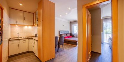 Familienhotel - Einzelzimmer mit Kinderbett - Appartement Family Comfort - Familien-Wellness Residence Tyrol