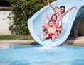 Kinderhotel: Familypool mit Wasserrutsche - Stroblhof Active Family Spa Resort